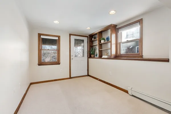 a view of an empty room with a window