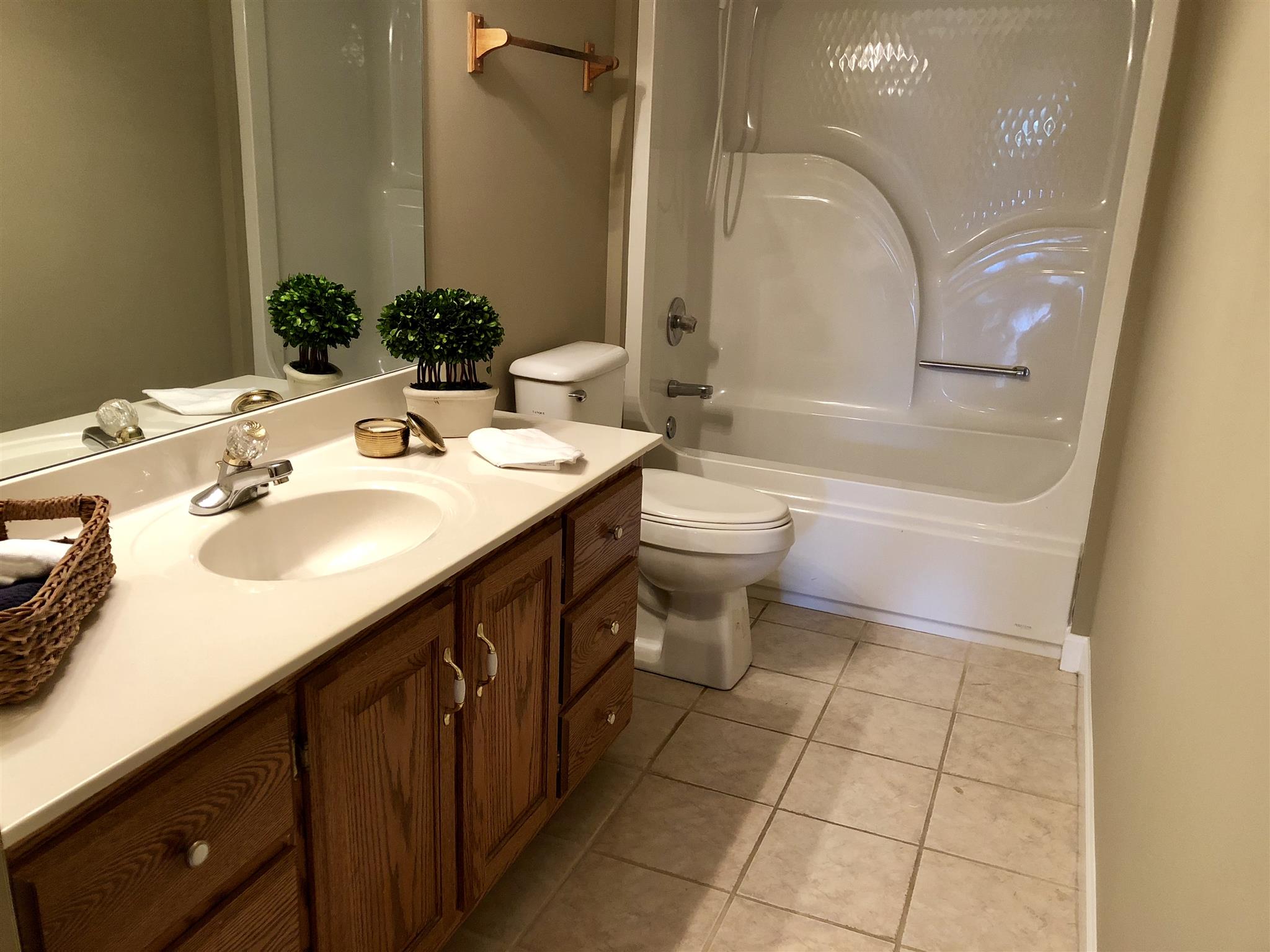 959 Wayside Road Manchester, TN 37355 - Photo 22 of 30 a bathroom with a sink a toilet and a mirror