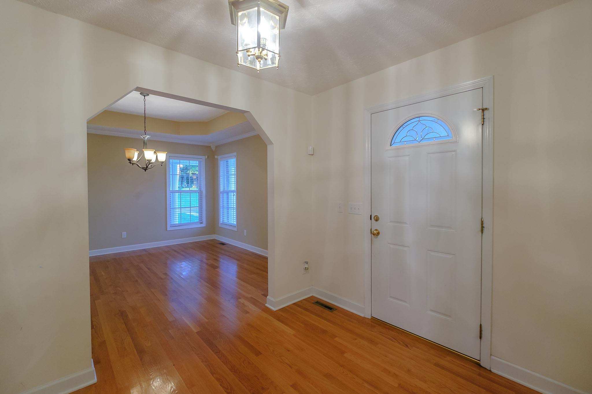 959 Wayside Road Manchester, TN 37355 - Photo 7 of 30 wooden floor in an empty room with a window