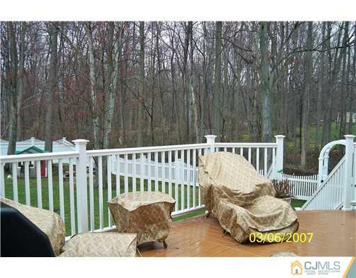 1669 Union Avenue, Unit NONE Hazlet, NJ 07730 - Photo 2 of 10 a view of a chair and tables