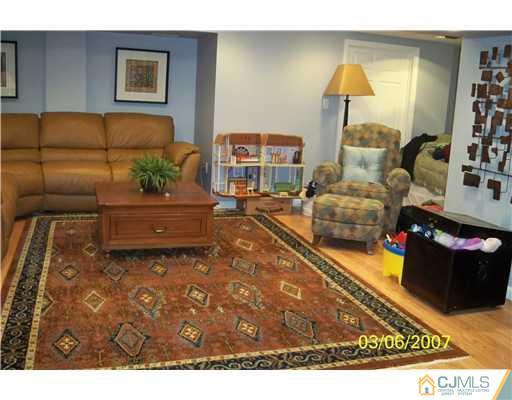 1669 Union Avenue, Unit NONE Hazlet, NJ 07730 - Photo 6 of 10 a living room with furniture and a couch