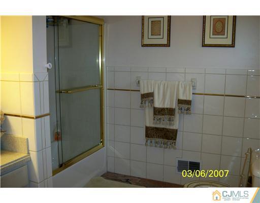 1669 Union Avenue, Unit NONE Hazlet, NJ 07730 - Photo 7 of 10 a bathroom with a shower