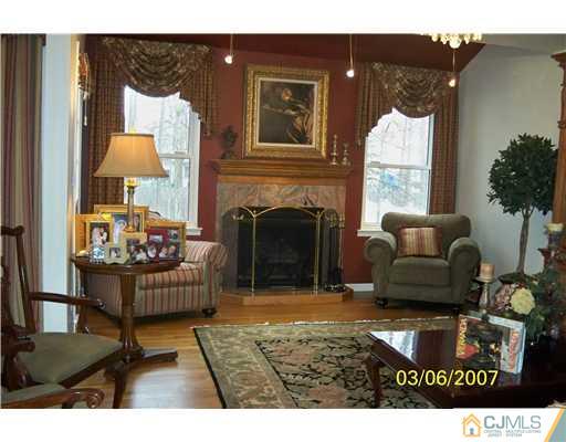 1669 Union Avenue, Unit NONE Hazlet, NJ 07730 - Photo 10 of 10 a living room with furniture and a fireplace