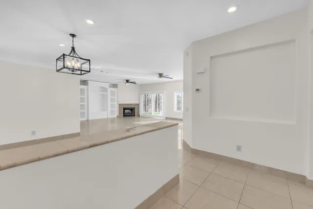 a kitchen with stainless steel appliances granite countertop a sink and a refrigerator