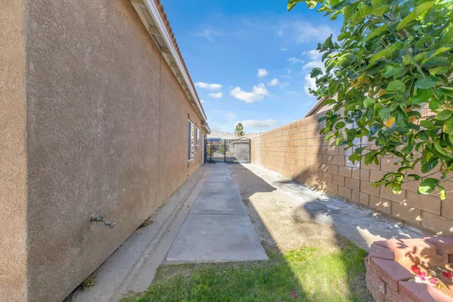 a view of backyard with patio