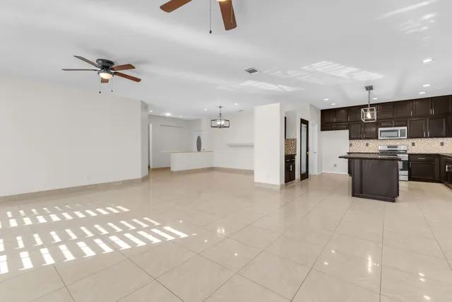 a view of empty room with kitchen appliances