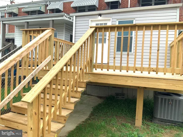 a view of a backyard with a garden and plants