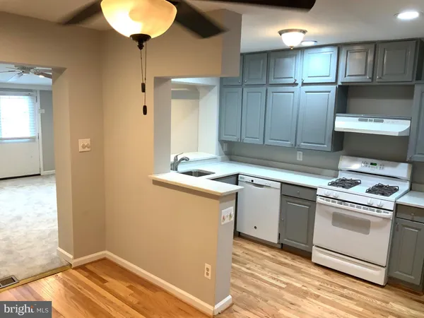 a kitchen with cabinets and appliances