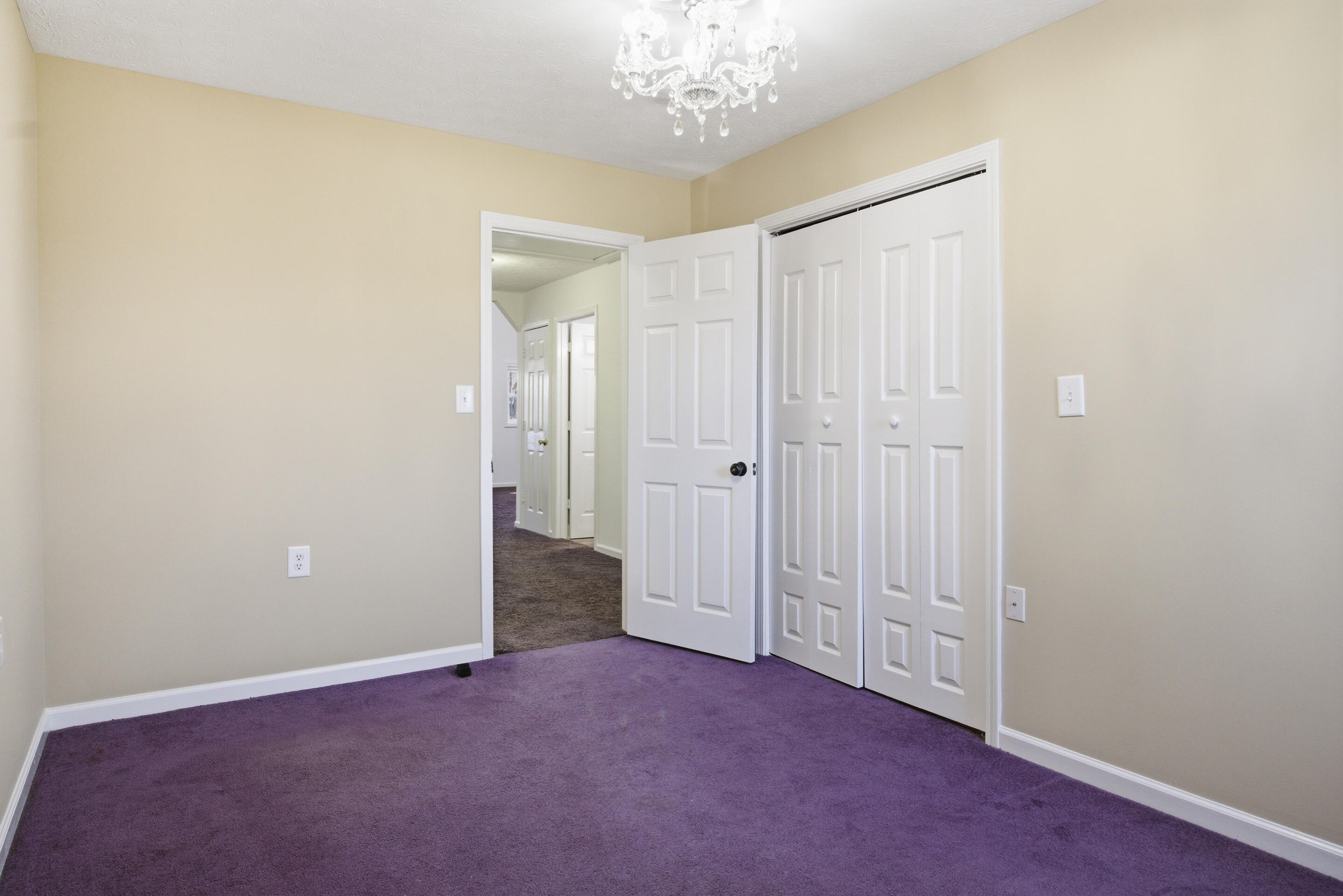 6458 Piney Woods Road Riner, VA 24149 - Photo 27 of 50 a view of an empty room and chandelier fan