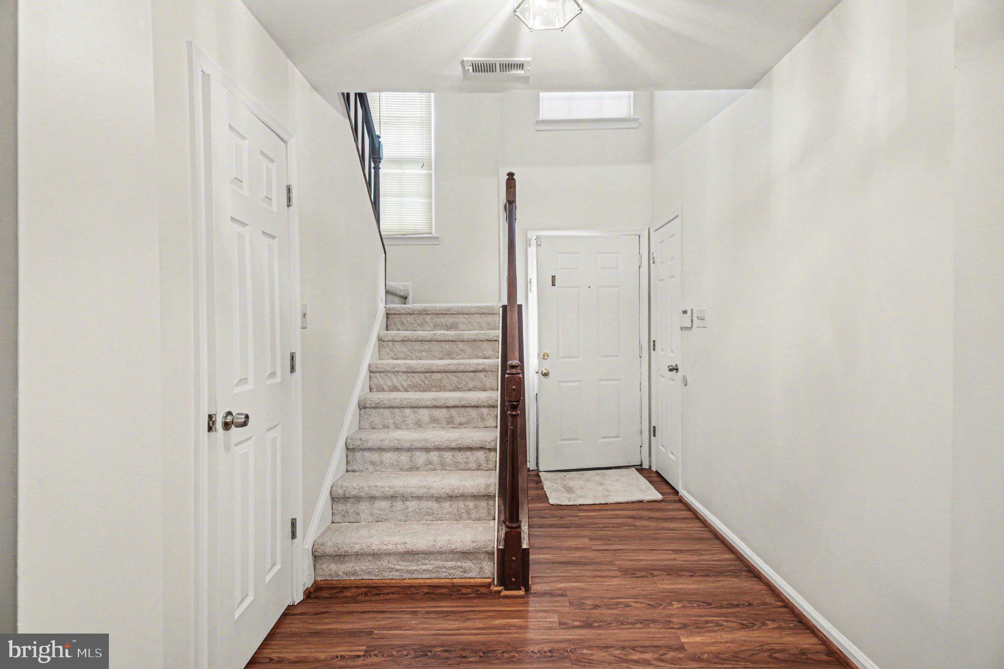 211 Wind Ridge Drive Stafford, VA 22554 - Photo 13 of 27 a view of a hallway with wooden floor and entryway