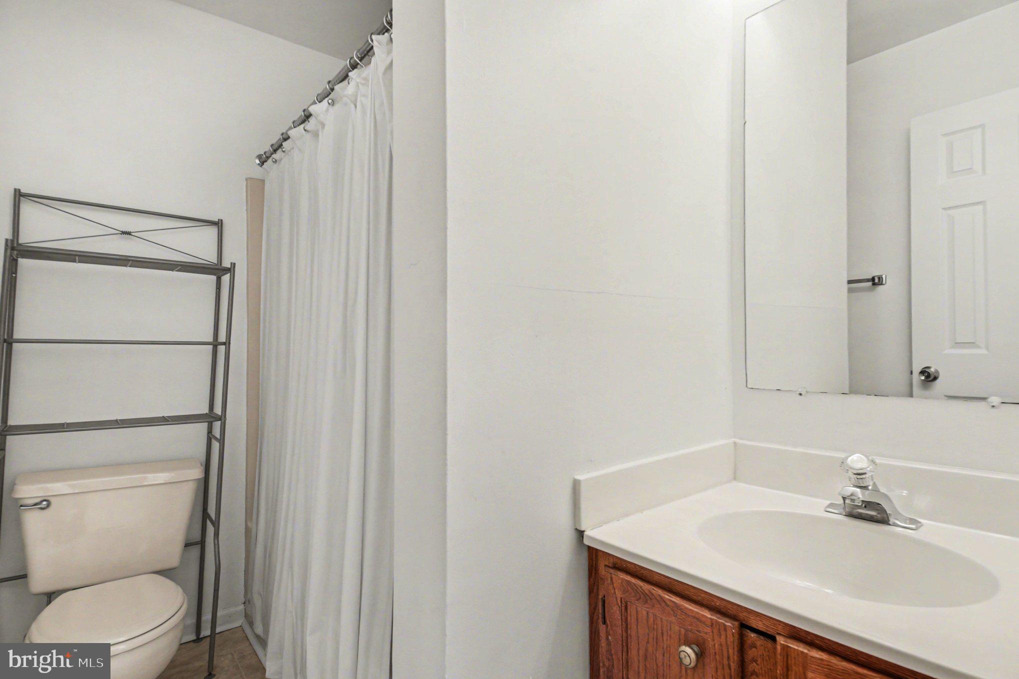 211 Wind Ridge Drive Stafford, VA 22554 - Photo 21 of 27 a bathroom with a sink toilet and shower