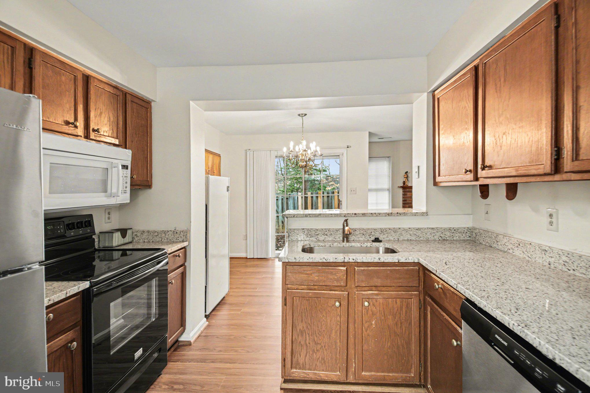 211 Wind Ridge Drive Stafford, VA 22554 - Photo 5 of 27 a kitchen with a sink stove top oven and refrigerator