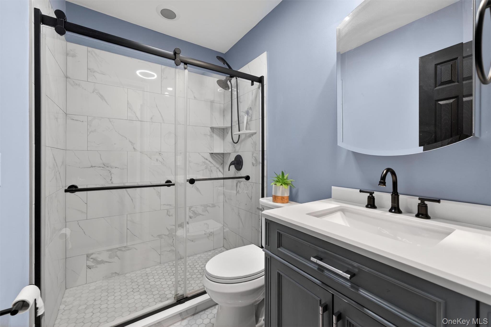 276 Temple Hill Road, Unit 2604 New Windsor, NY 12553 - Photo 17 of 31 a bathroom with a sink toilet and shower