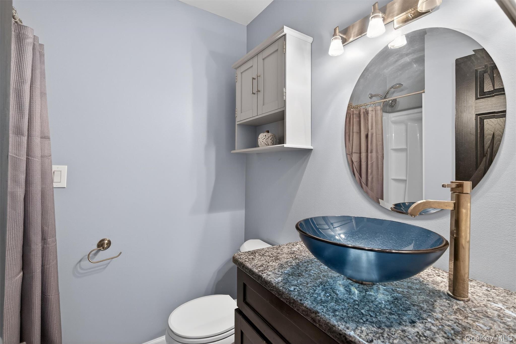 276 Temple Hill Road, Unit 2604 New Windsor, NY 12553 - Photo 21 of 31 a bathroom with a granite countertop toilet sink and mirror