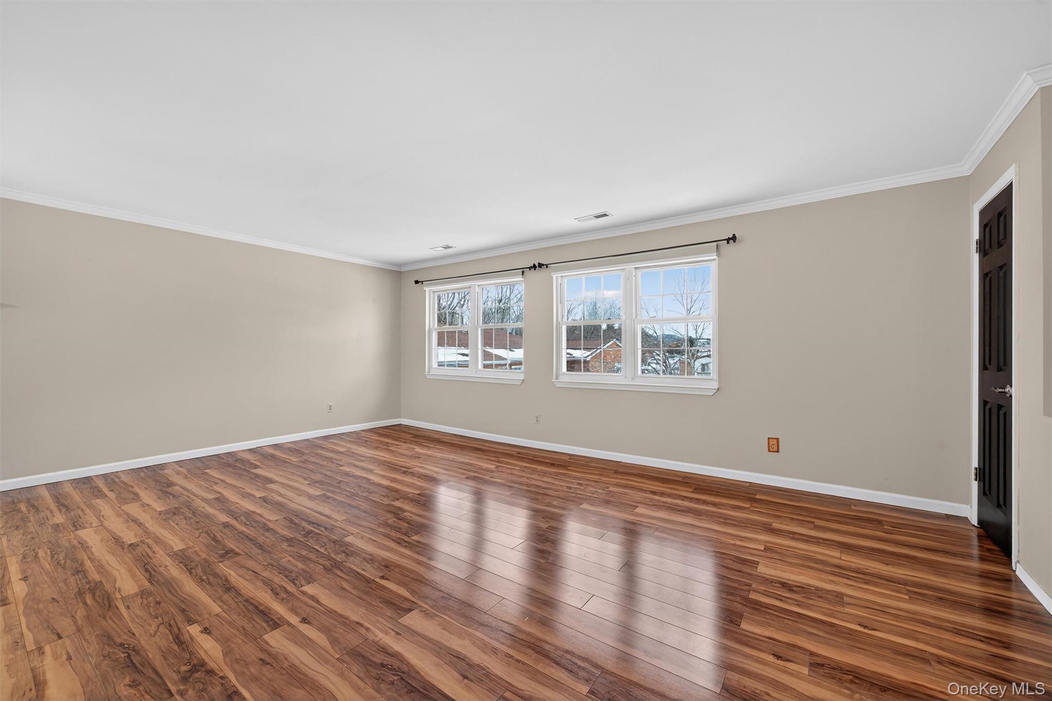 276 Temple Hill Road, Unit 2604 New Windsor, NY 12553 - Photo 4 of 31 a view of empty room with wooden floor and fan