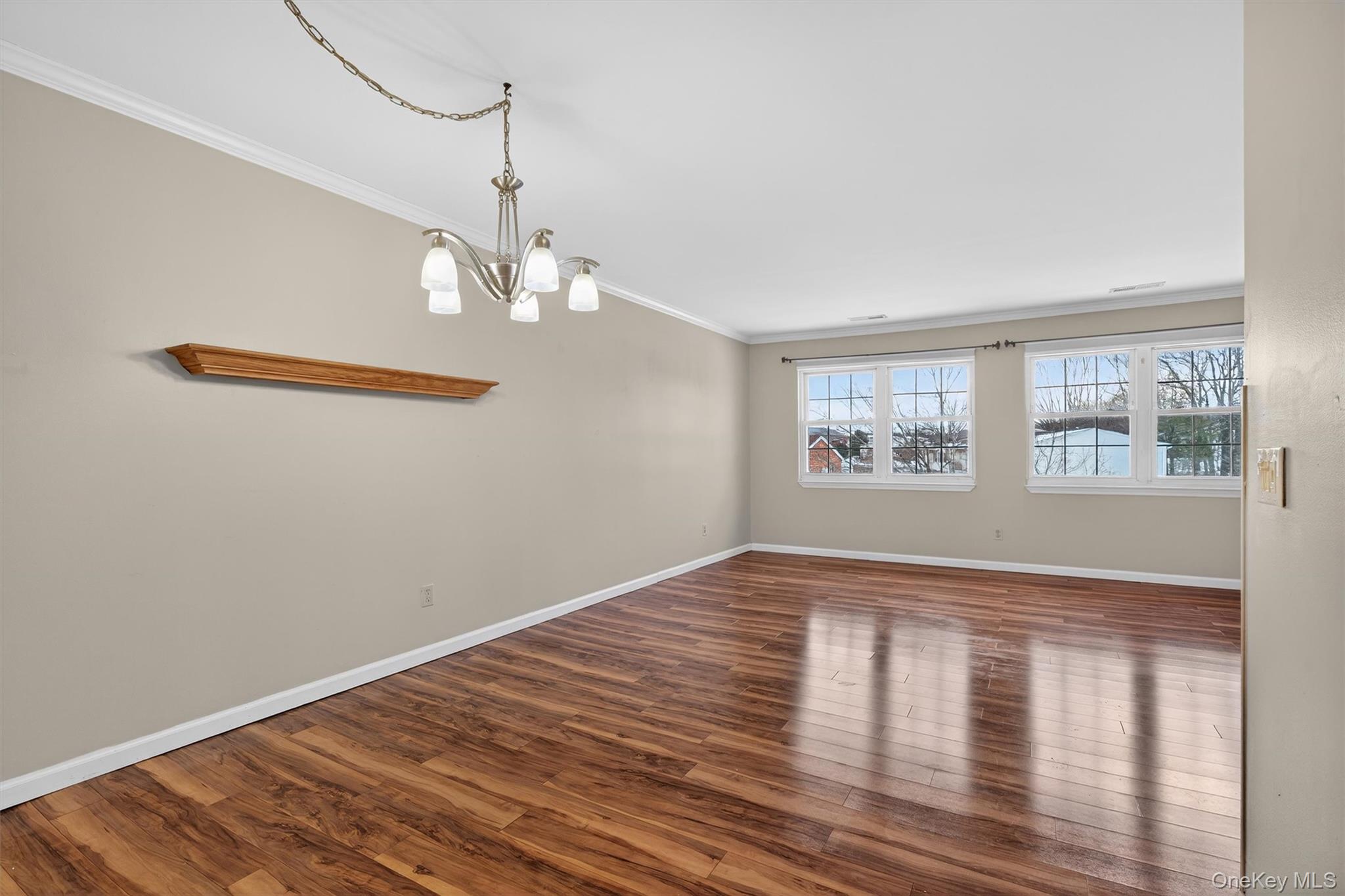 276 Temple Hill Road, Unit 2604 New Windsor, NY 12553 - Photo 5 of 31 a view of empty room with wooden floor and fan
