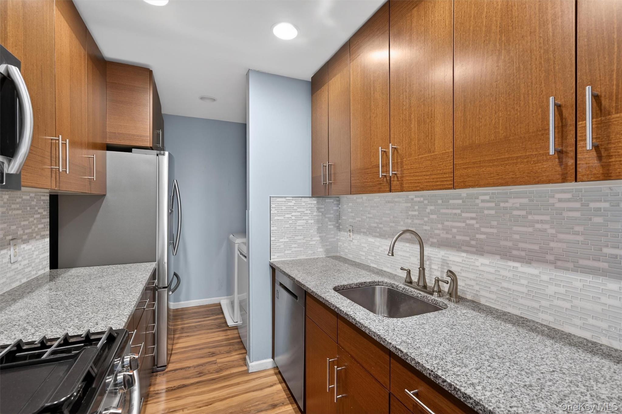 276 Temple Hill Road, Unit 2604 New Windsor, NY 12553 - Photo 9 of 31 a kitchen with sink cabinets and stove