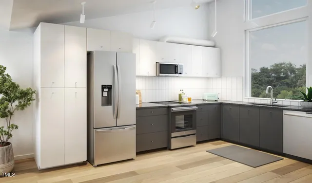a kitchen with a refrigerator and a sink