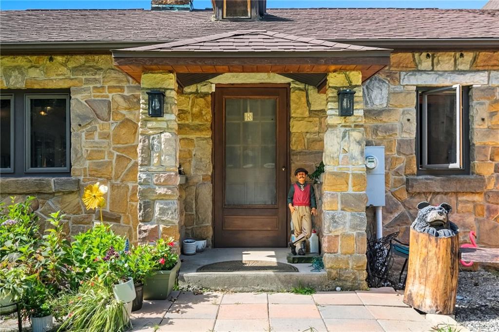 128 Courson Lane Emlenton, PA 16373 - Photo 13 of 50 a front view of a building with a potted plant