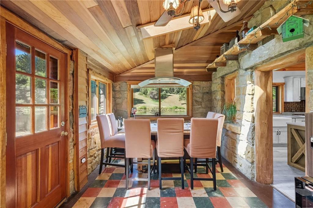 128 Courson Lane Emlenton, PA 16373 - Photo 27 of 50 a dining room with furniture a chandelier and wooden floor