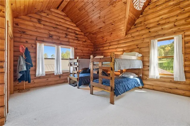 a bed room with furniture and a window