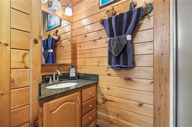 a close view of a sink and dishwasher with refrigerator