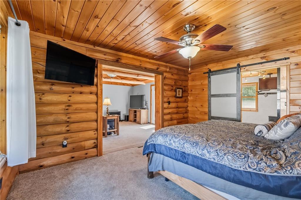 128 Courson Lane Emlenton, PA 16373 - Photo 36 of 50 a bedroom with a bed and a walk in closet