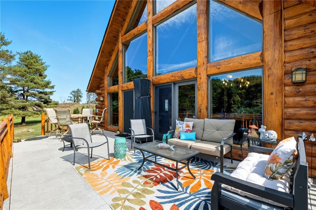 128 Courson Lane Emlenton, PA 16373 - Photo 40 of 50 a view of an outdoor sitting area with furniture and umbrella
