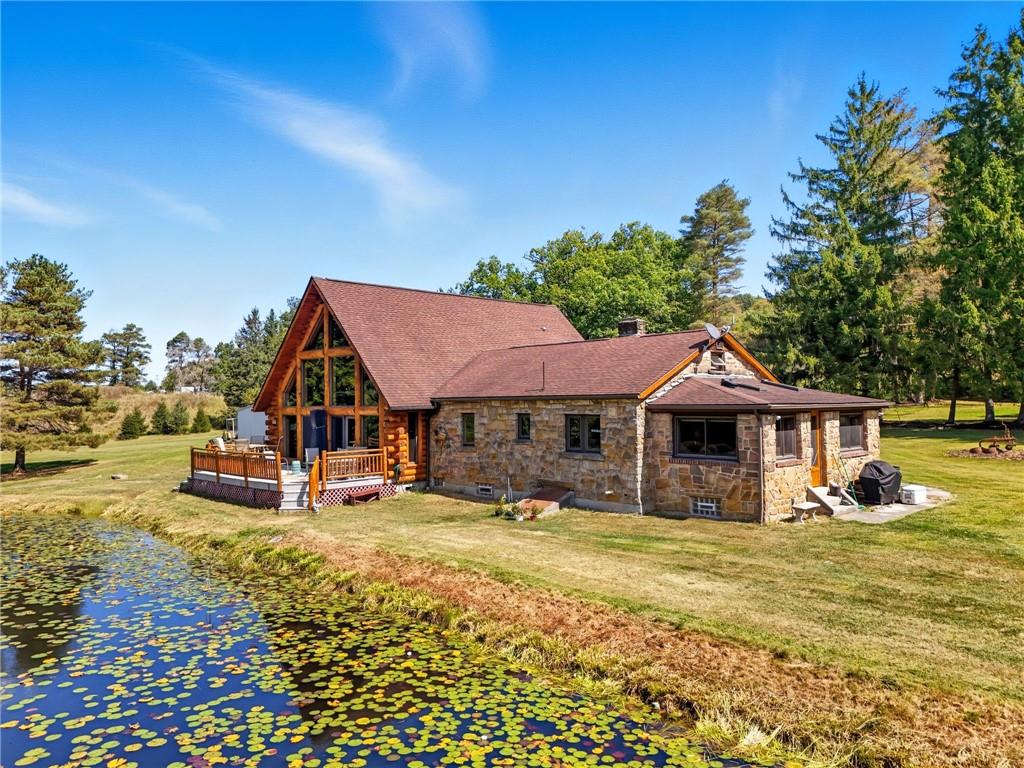 128 Courson Lane Emlenton, PA 16373 - Photo 42 of 50 a front view of a house with a yard table and chairs
