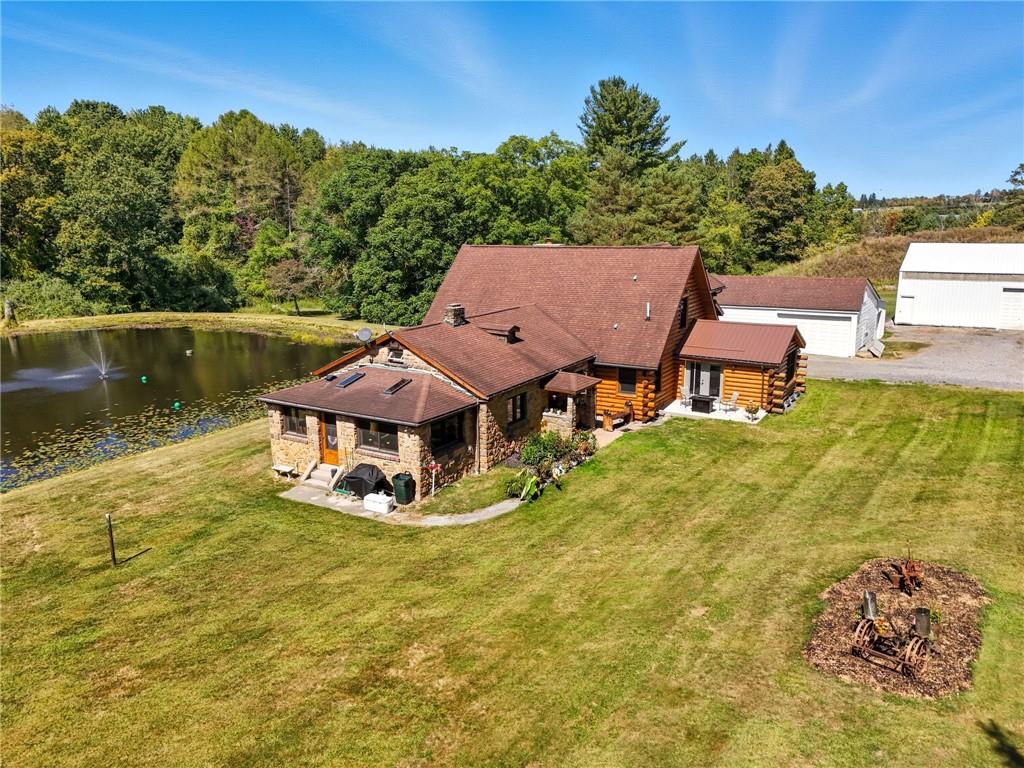 128 Courson Lane Emlenton, PA 16373 - Photo 43 of 50 a view of a lake with a yard and large trees
