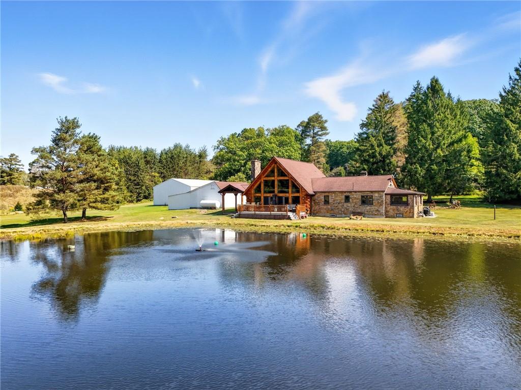128 Courson Lane Emlenton, PA 16373 - Photo 44 of 50 a view of a swimming pool with an outdoor space and seating area