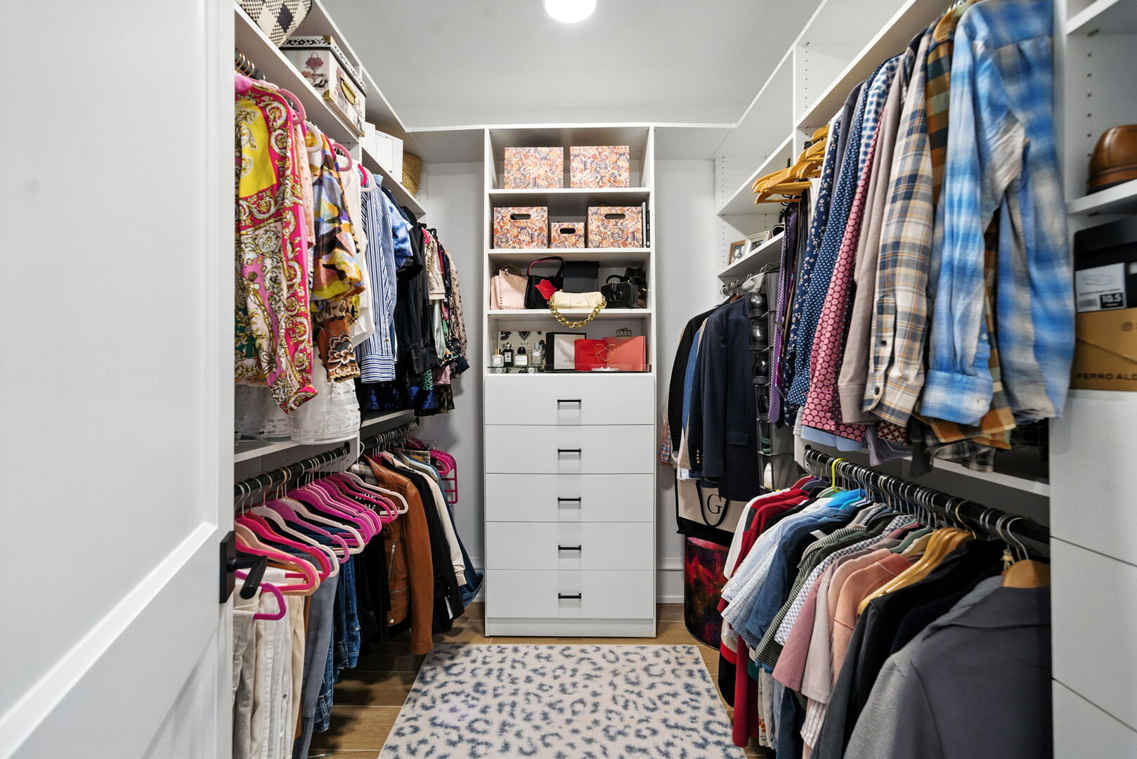 1733 North Mohawk Street, Unit 1N Chicago, IL 60614 - Photo 21 of 29 a view of walk in closet with clothes and shoes