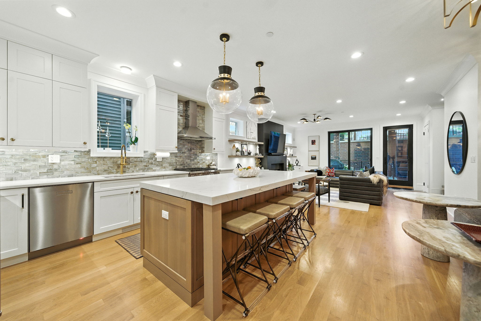 1733 North Mohawk Street, Unit 1N Chicago, IL 60614 - Photo 8 of 29 a large kitchen with kitchen island a large counter space a sink appliances and cabinets