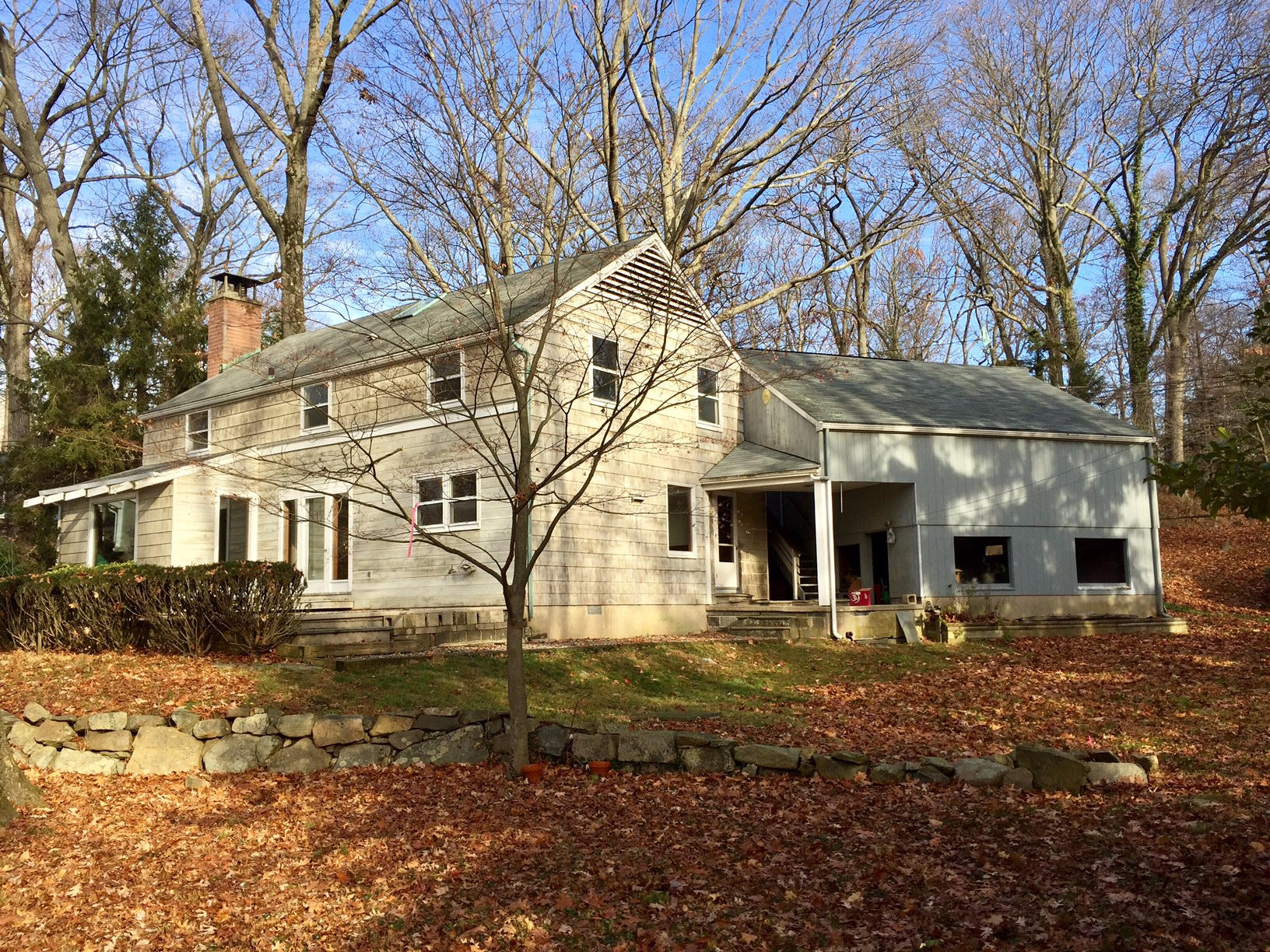 5 Little Brook Road Rowayton, CT 06853 - Photo 1 of 4 a front view of a house with a yard