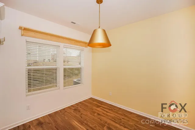 a kitchen with a sink stainless steel appliances and cabinets
