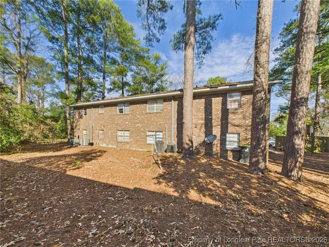 a view of street with large trees