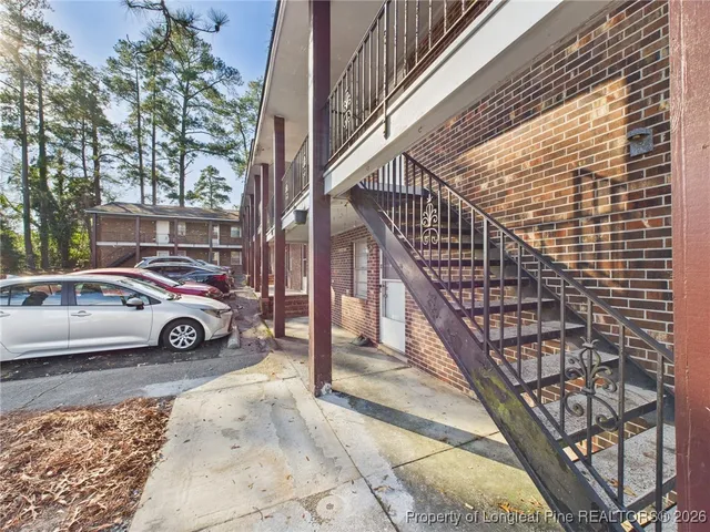 a view of street with parked cars