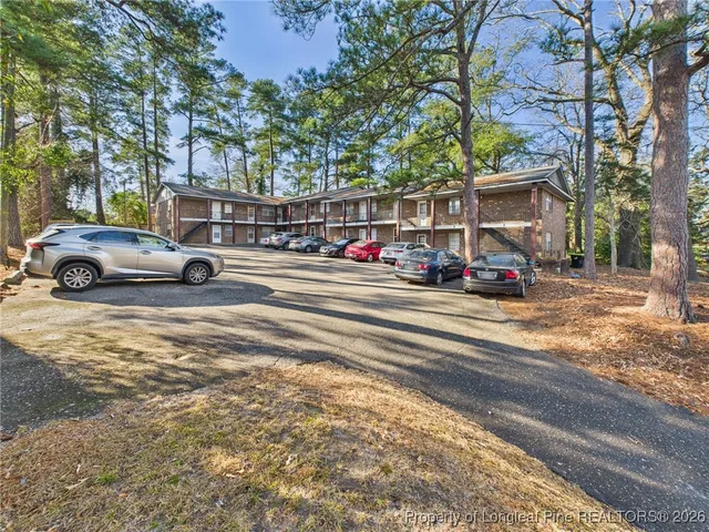 a view of a livingroom with wooden floor and chair