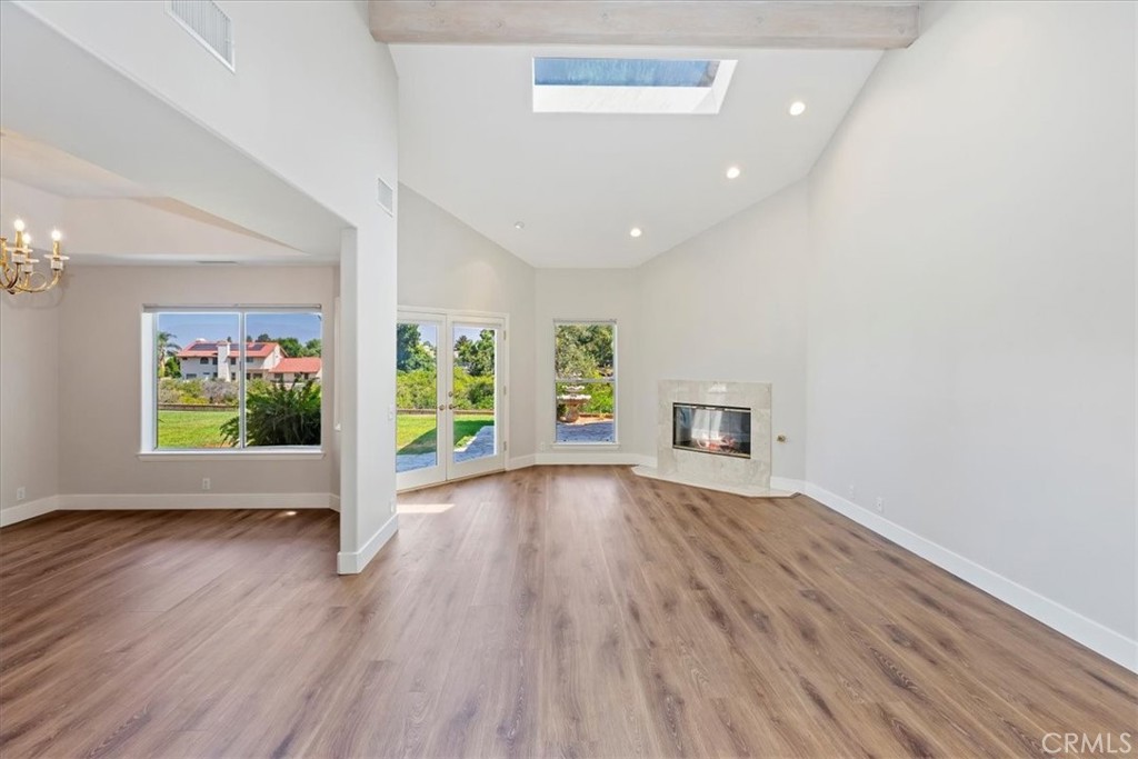 1507 Weston Way Riverside, CA 92506 - Photo 11 of 55 wooden floor in an empty room with a window
