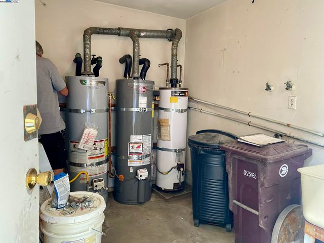a kitchen with a refrigerator and a stove