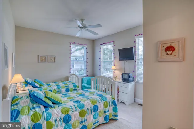 a view of a dining room with furniture and a chandelier