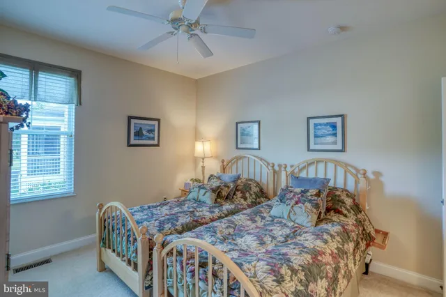 a bedroom with a bed and a table