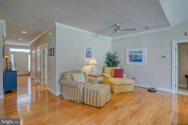 a kitchen with stainless steel appliances granite countertop a sink refrigerator and cabinets