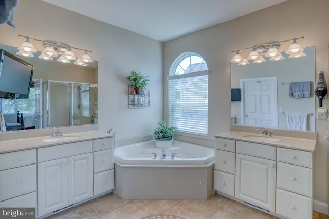 a kitchen with granite countertop a sink stove and cabinets