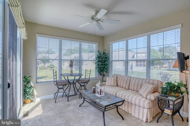 an aerial view of a house with a swimming pool yard and outdoor seating
