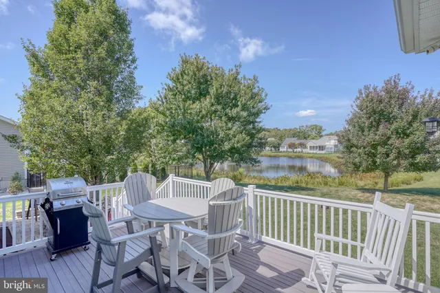 an aerial view of a house with swimming pool patio and outdoor seating