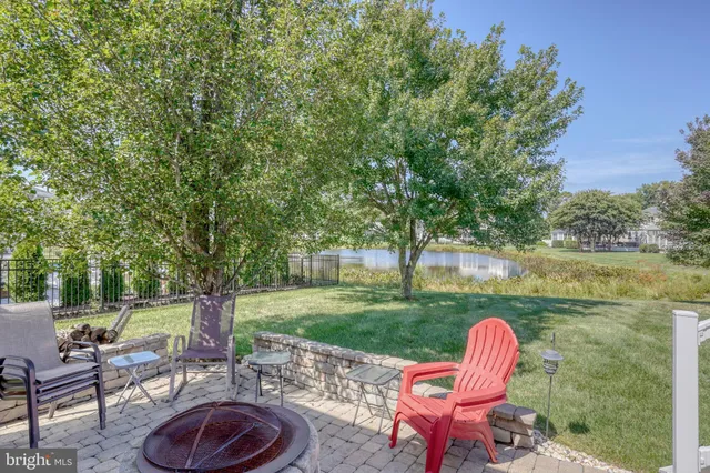 a view of a yard with potted plants