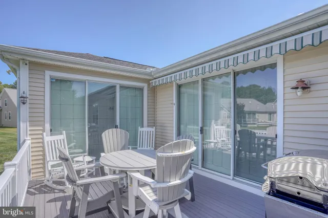 a view of a yard with table and chairs