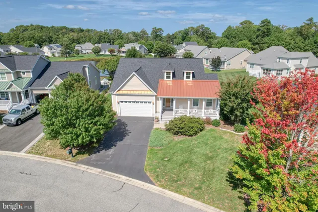 a view of a workspace with furniture and a potted plant