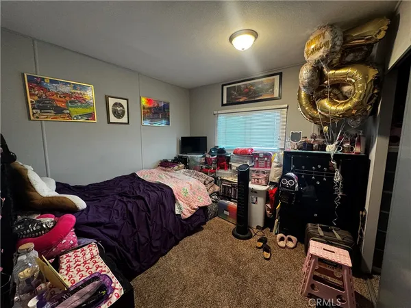 a bed room with a bed and furniture